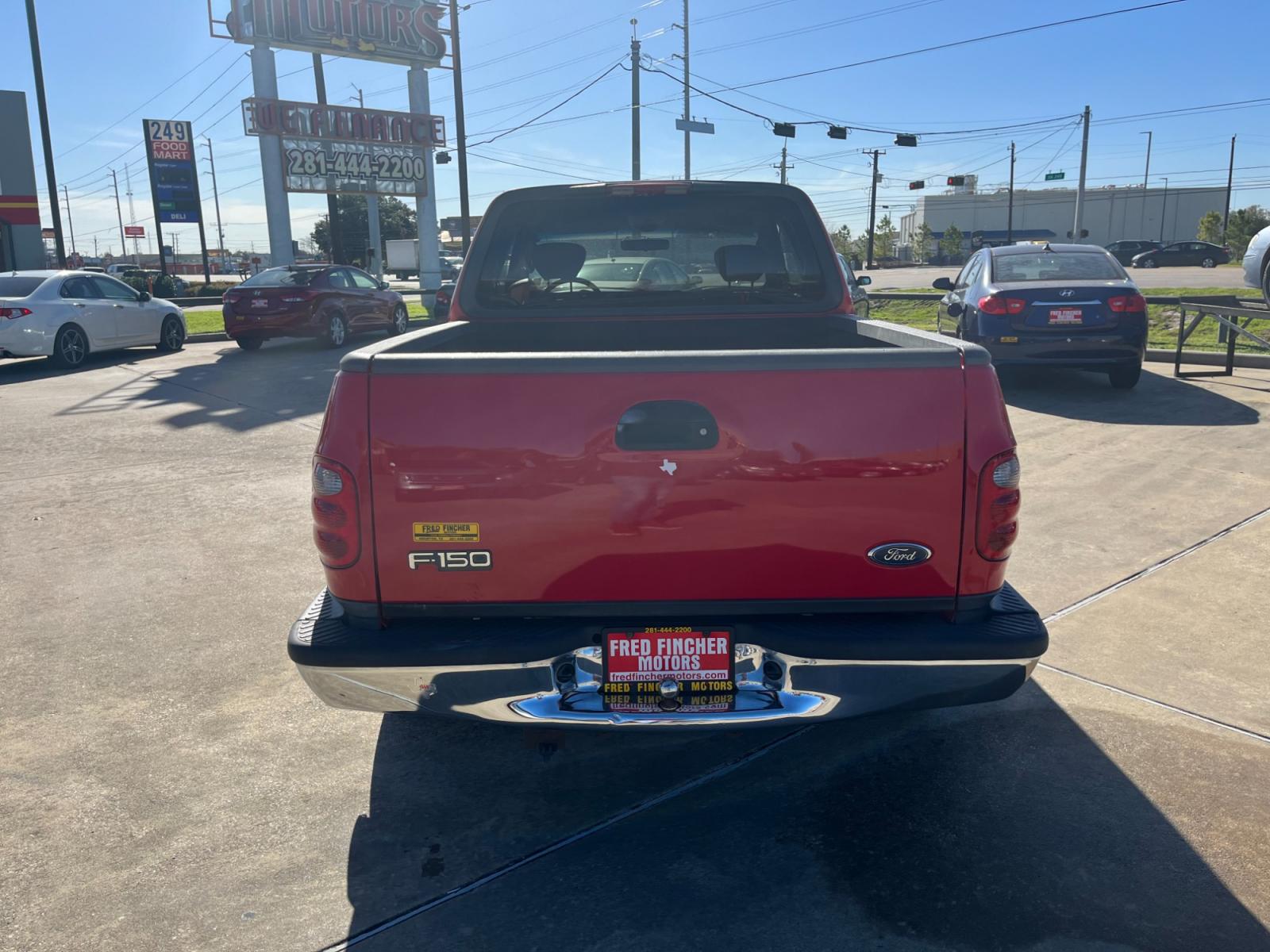 2003 red /TAN Ford F-150 XL SuperCab Flareside 2WD (1FTRX07213K) with an 4.2L V6 OHV 12V engine, Automatic transmission, located at 14700 Tomball Parkway 249, Houston, TX, 77086, (281) 444-2200, 29.928619, -95.504074 - Photo #5